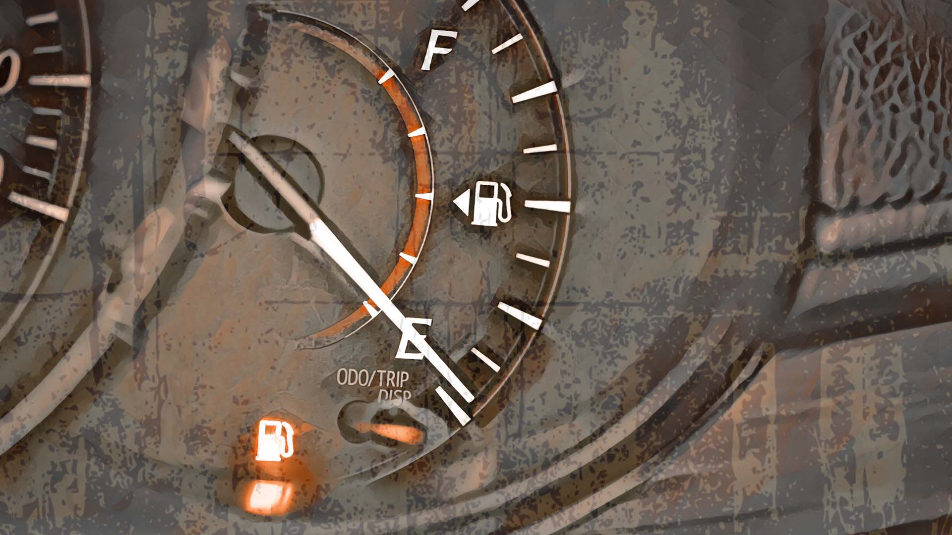 A fuel gauge's needle is on empty, indicating a possible no-gas situation.