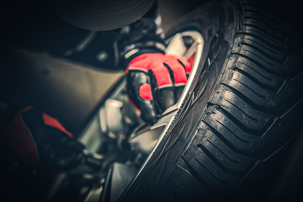 Modern Car Wheel Under Maintenance Closeup.