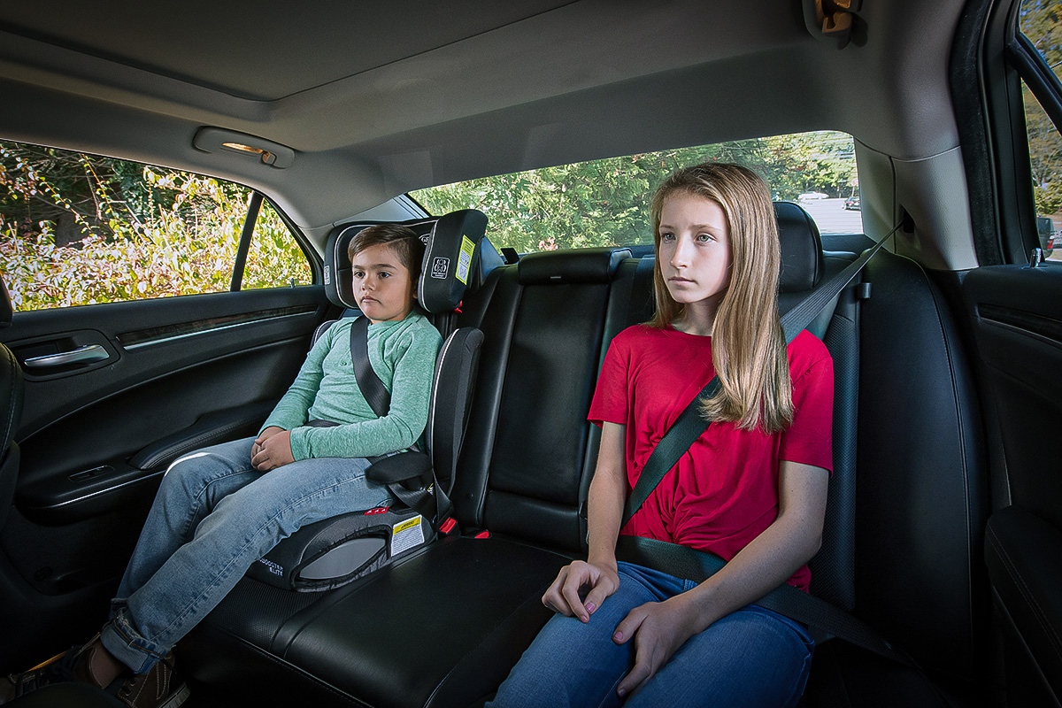 kids in seat belts and car seat